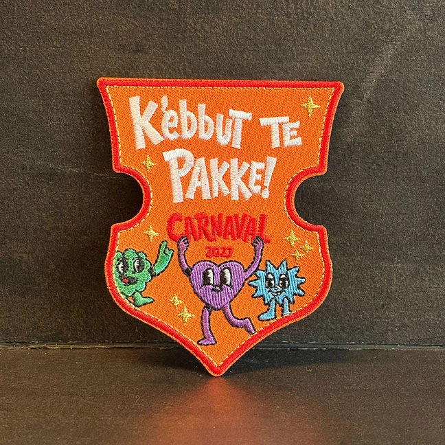 K'ebbut te pakke - motto 2027 - Kielegatemblemen motto2027 carnavalbreda - IN100-12